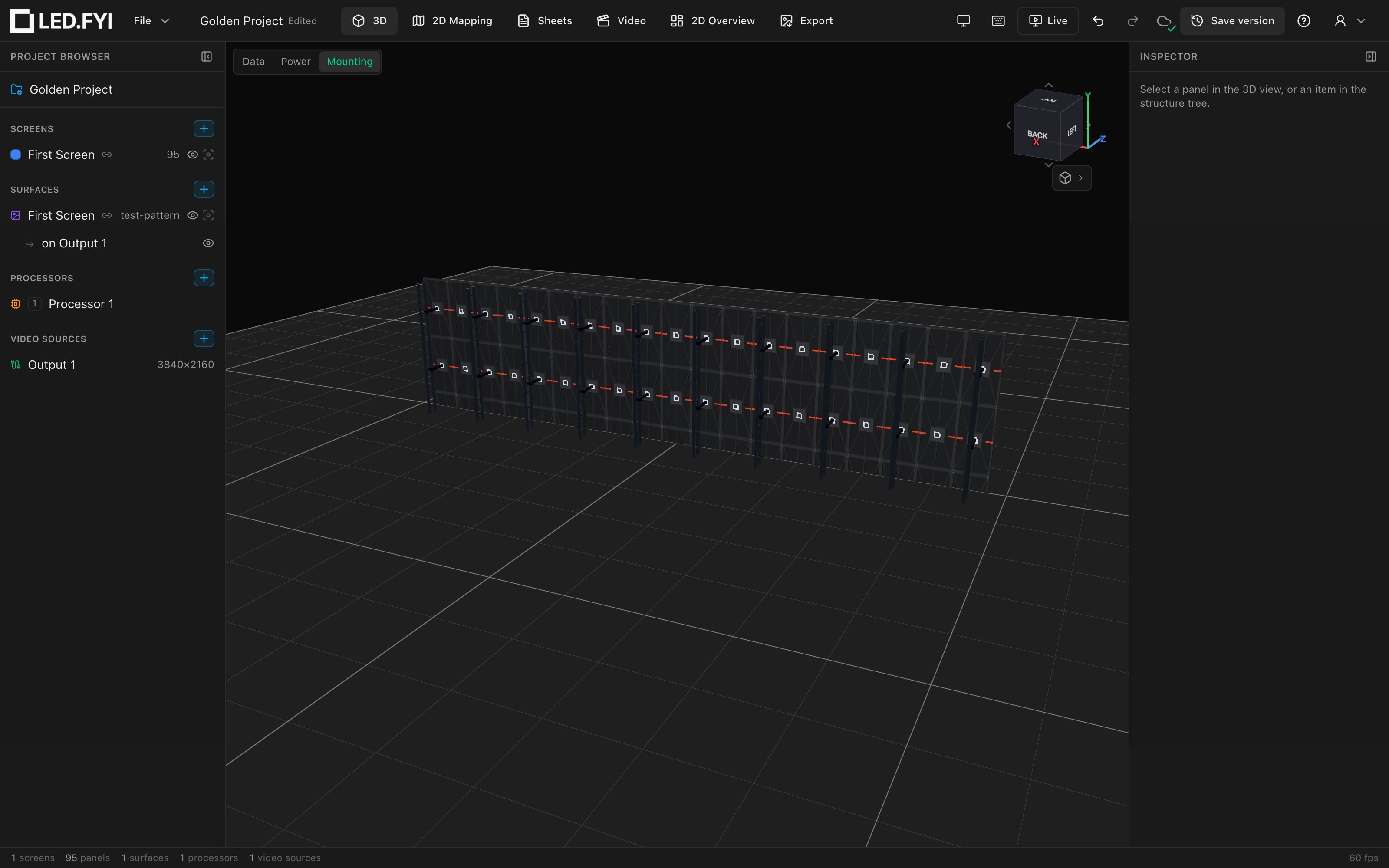 The 3D view from behind a ground-stacked wall: vertical truss towers behind every other column, ground trusses on the floor, and bridge clamps up the rows