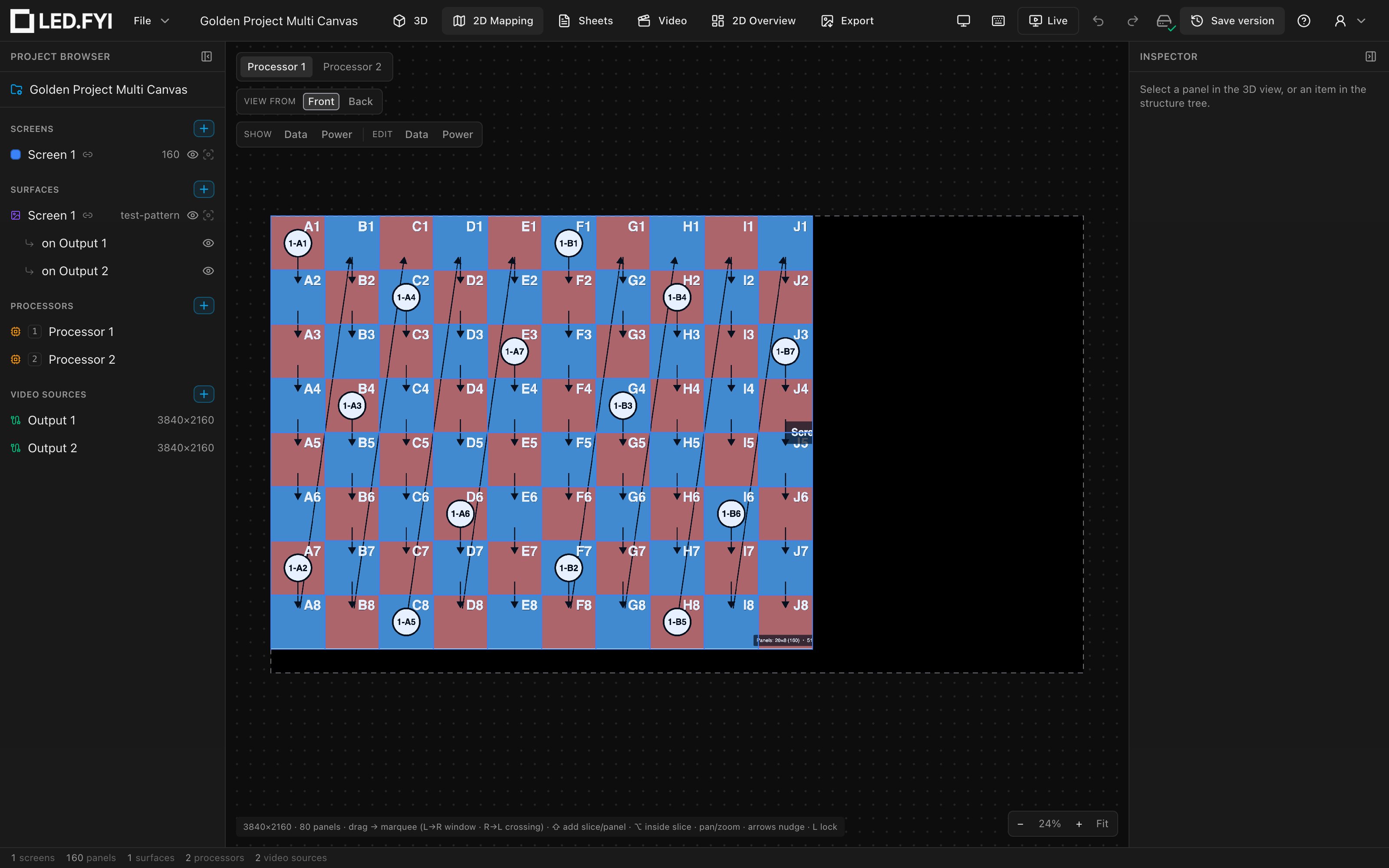 The 2D Mapping view of a split screen: the processor switcher pills top-left, half the wall on this canvas