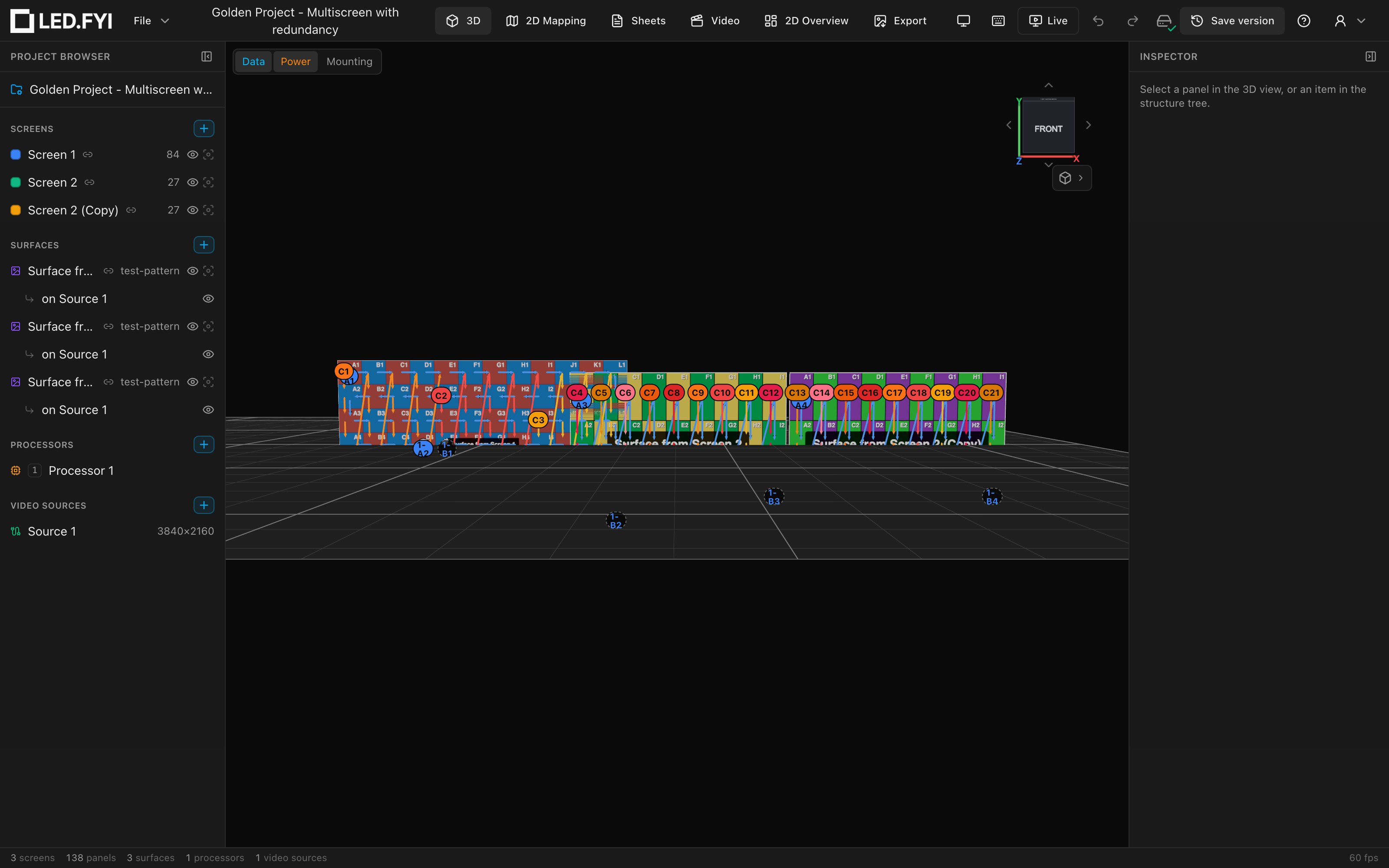 Data and Power overlays over a multi-screen wall: coloured arrow runs, port chips at string starts, dashed backup chips