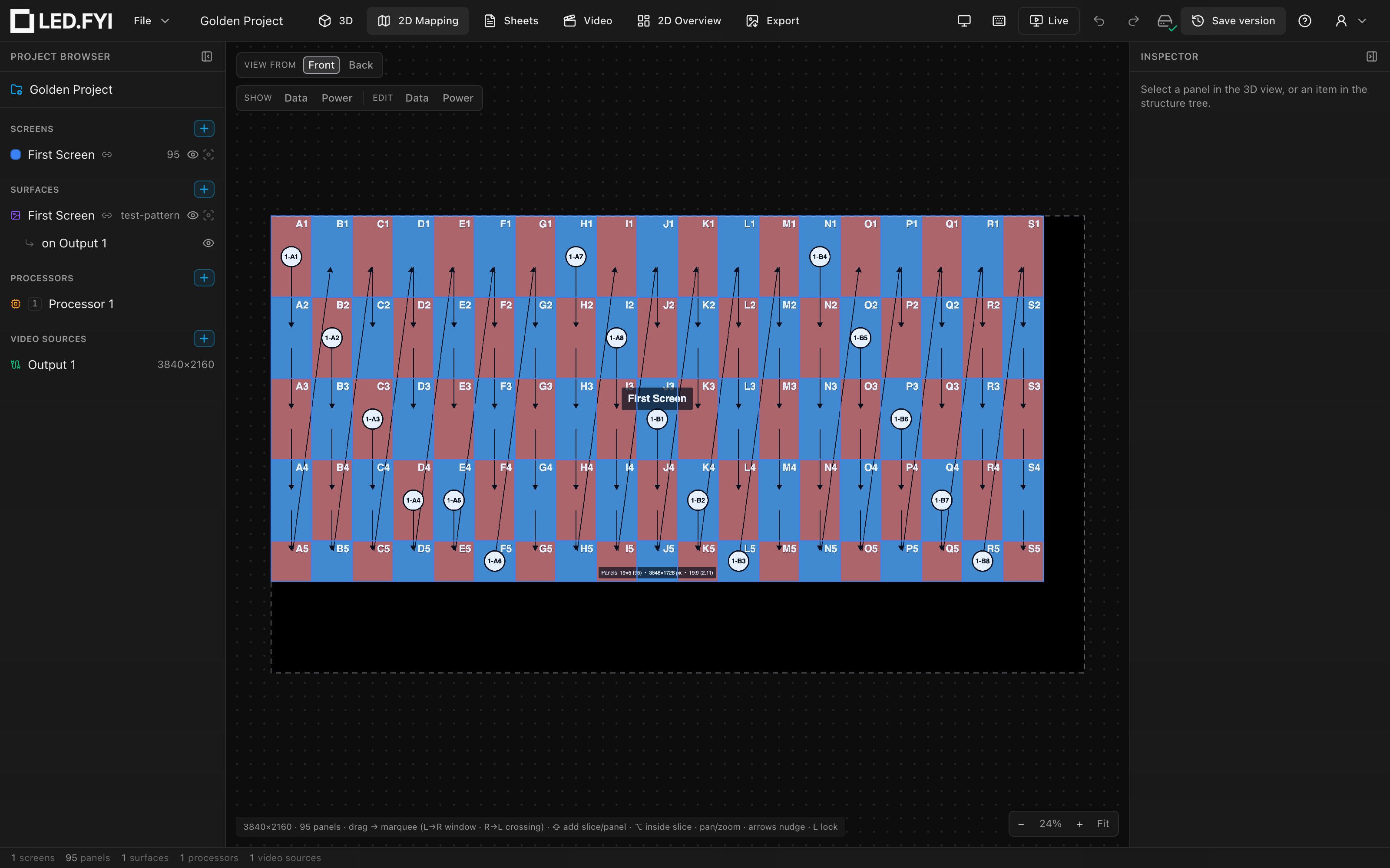 The 2D Mapping workbench showing the Golden Project: the dashed canvas boundary, the live test-pattern content, the panel grid, the wiring toolbar top-left, the zoom controls bottom-right, and the status chip bottom-left